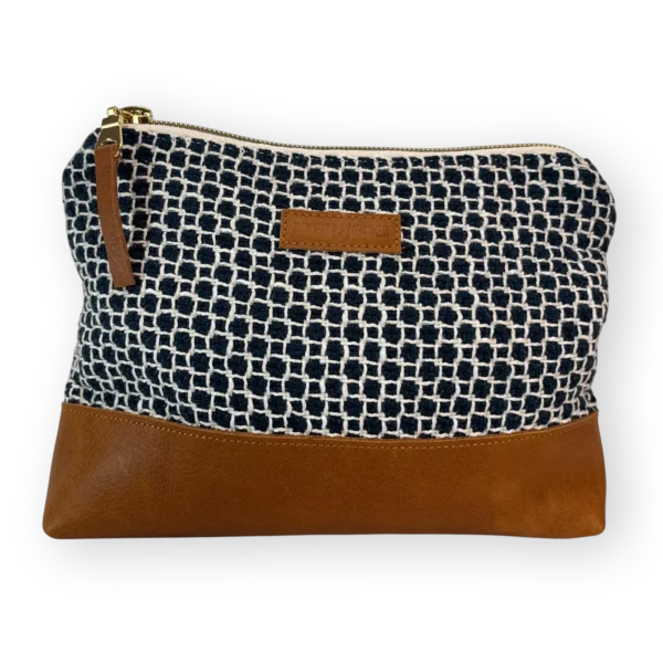 drakensberg-medium-leather-pouch-front Drakensberg medium leather pouch front with patterned navy and cream textile and tan genuine leather